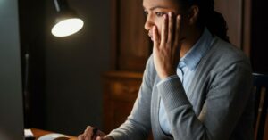 person researching inheritance lenders on her computer